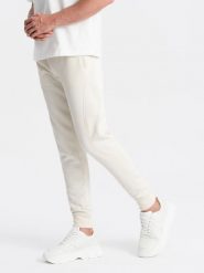 Bawełniane męskie dresowe spodnie joggery BASIC – kremowe V5 OM-PABS-0174 - XXL. Białe spodnie sportowe męskie Ombre Clothing, l, bez wzorów, z bawełny. Za 119.99 zł.