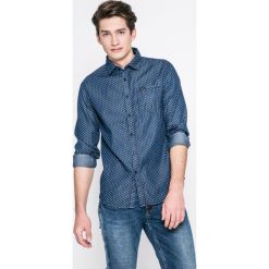 Guess Jeans - Koszula Clyde. Niebieskie koszule męskie Guess Jeans, m, z aplikacjami, z bawełny, casualowe, bez kołnierzyka, bez ramiączek. W wyprzedaży za 199.90 zł.