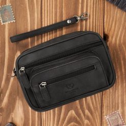 Saszetka męska czarna skórzana do ręki vintage Paolo Peruzzi T-130-HBL. Czarne saszetki i nerki męskie bez wzorów, ze skóry. Za 129.00 zł.