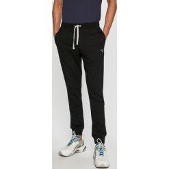 Emporio Armani - Spodnie. Niebieskie spodnie materiałowe męskie Emporio Armani, bez wzorów, z bawełny. W wyprzedaży za 239.90 zł.