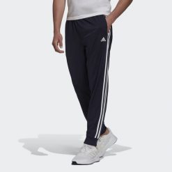 Primegreen Essentials Warm-Up Tapered 3-Stripes Track Pants. Białe spodnie sportowe męskie Adidas, l, bez wzorów, z dresówki, na fitness i siłownię. Za 182.00 zł.