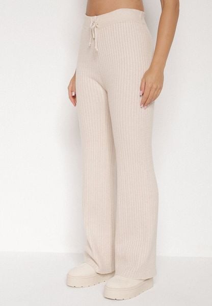 Jasnobeżowe Prążkowane Spodnie z Wełną o Szerokim Kroju z Wysokim Stanem Reinnia. Brązowe spodnie materiałowe damskie Born2be, bez wzorów, z jeansu, z podwyższonym stanem. Za 79.99 zł.