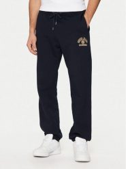 Guess Jeans Spodnie dresowe M5RB52 KCPR1 Granatowy Regular Fit. Niebieskie spodnie sportowe męskie Guess Jeans, m, z aplikacjami, z bawełny. Za 169.99 zł.