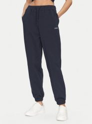 Guess Spodnie dresowe V5GB03 KCS01 Granatowy Regular Fit. Niebieskie spodnie dresowe damskie Guess, z aplikacjami, z bawełny. Za 189.99 zł.