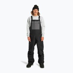 Spodnie snowboardowe męskie DC Docile Bib. Czarne spodnie sportowe męskie DC Shoes, m, bez wzorów, narciarskie. Za 609.99 zł.