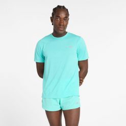Koszulka męska New Balance MT41253CYJ – niebieska. Niebieskie koszulki sportowe męskie New Balance, m, bez wzorów, z materiału, bez ramiączek, na fitness i siłownię. Za 99.99 zł.