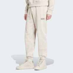Spodnie Dresowe Mercedes - Amg Petronas Formula One Team Premium. Brązowe spodnie sportowe męskie Adidas, l, bez wzorów, z dresówki, na fitness i siłownię. Za 399.00 zł.