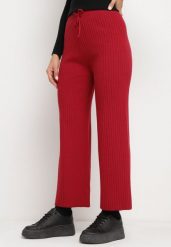 Bordowe Spodnie z Szerokimi Prążkowanymi Nogawkami Romese. Czerwone spodnie materiałowe damskie Born2be, bez wzorów, z jeansu, eleganckie. Za 64.99 zł.