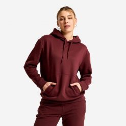 Bluza z kapturem damska Essential. Fioletowe bluzy damskie Decathlon, l, bez wzorów, z materiału, klasyczne, bez ramiączek, z kapturem. Za 89.99 zł.