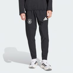 Spodnie Germany Tiro Travel. Czarne spodnie sportowe męskie Adidas, bez wzorów, z dresówki, do piłki nożnej. Za 329.00 zł.