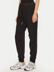 Champion Spodnie dresowe 117477 Czarny Slim Fit. Czarne spodnie dresowe damskie Champion, bez wzorów, z dresówki. Za 199.99 zł.