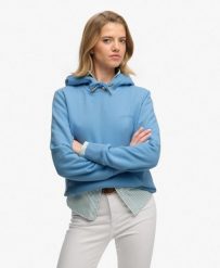 Superdry Bluza z kapturem Essential Logo haftowana – krój relaxed. Niebieskie bluzy damskie Superdry, z aplikacjami, z bawełny, klasyczne, bez ramiączek, z kapturem. Za 279.65 zł.