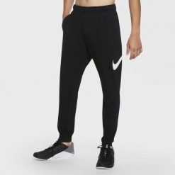 Spodnie treningowe damskie Nike Taper. Czarne spodnie dresowe damskie Nike, bez wzorów, sportowe. Za 492.00 zł.