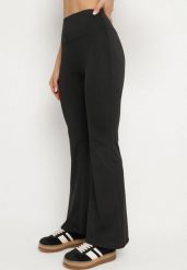 Czarne Spodnie Legginsy Typu Dzwony z Wysokim Stanem Melonell. Czarne legginsy damskie Born2be, bez wzorów, z jeansu. Za 49.99 zł.