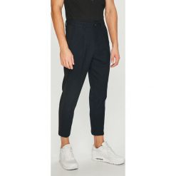 Jack & Jones - Spodnie. Czarne eleganckie spodnie męskie Jack & Jones, bez wzorów, z elastanu. W wyprzedaży za 129.90 zł.