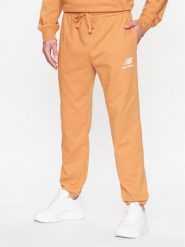 New Balance Spodnie dresowe MP31539 Żółty Regular Fit. Żółte spodnie sportowe męskie New Balance, m, bez wzorów, z dresówki. Za 269.99 zł.