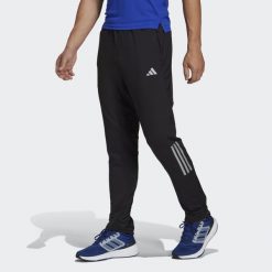Spodnie Own the Run Astro Knit. Czarne spodnie materiałowe męskie Adidas, xl, bez wzorów, do biegania. Za 299.00 zł.