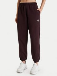 Calvin Klein Jeans Spodnie dresowe Monologo LV047B235G Brązowy Regular Fit. Brązowe spodnie dresowe damskie Calvin Klein Jeans, bez wzorów, z bawełny. Za 309.99 zł.