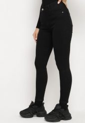Czarne Jeansy Skinny Bawełniane Push-Up Torialdia. Czarne jeansy damskie Born2be, bez wzorów, z bawełny, eleganckie, z podwyższonym stanem. Za 69.99 zł.