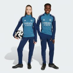 Spodnie treningowe Arsenal Tiro 25 Competition. Niebieskie spodnie dresowe damskie Adidas, bez wzorów, z dresówki, na fitness i siłownię. Za 259.00 zł.