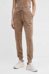 GUESS Brązowe damskie spodnie welurowe Couture. Brązowe spodnie dresowe damskie Guess, z aplikacjami, z dresówki. W wyprzedaży za 236.99 zł.