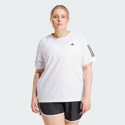 Koszulka Own The Run (Plus Size). Czarne bluzki damskie Adidas, plus size, bez wzorów, z materiału, sportowe, bez kołnierzyka, plus size, bez ramiączek. Za 159.00 zł.