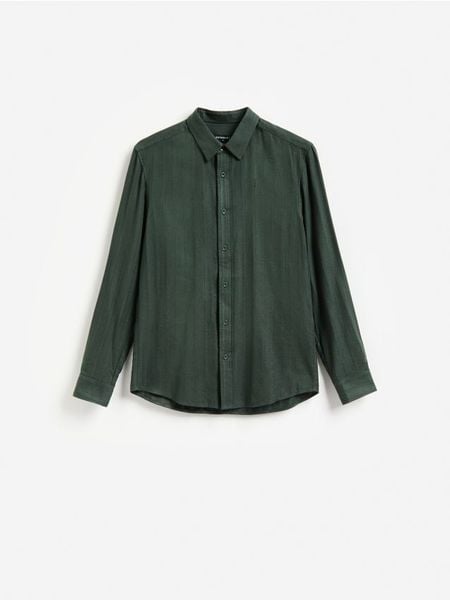 Koszula slim fit z bawełną - morski. Zielone koszule męskie Reserved, l, bez wzorów, z bawełny, bez kołnierzyka, bez ramiączek. W wyprzedaży za 89.99 zł.