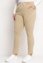 Beżowe Spodnie z Gumką i Sznurkiem w Pasie z Prostymi Nogawkami Averlija. Brązowe spodnie materiałowe damskie Born2be, bez wzorów, z dresówki, plus size. Za 49.99 zł.