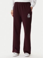 Tommy Hilfiger Spodnie dresowe UW0UW06081 Bordowy Wide Leg. Czerwone spodnie dresowe damskie Tommy Hilfiger, bez wzorów, z bawełny. Za 279.99 zł.
