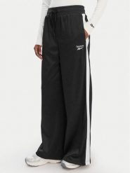 Reebok Spodnie dresowe Dianne RK25512CCW Czarny Relaxed Fit. Czarne spodnie sportowe damskie Reebok, bez wzorów, z dresówki. Za 199.99 zł.