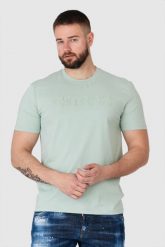 GUESS Pistacjowy t-shirt męski z wytłaczanym logo. Zielone t-shirty męskie Guess, m, z aplikacjami, bez kołnierzyka, bez ramiączek. W wyprzedaży za 109.99 zł.