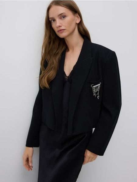 Marynarka z ozdobną aplikacją - czarny. Czarne marynarki i żakiety damskie Reserved, z aplikacjami, z bawełny, bez kołnierzyka, bez ramiączek. W wyprzedaży za 139.99 zł.