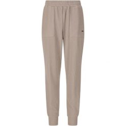 Damskie spodnie dresowe Athlecia Reiley. Brązowe spodnie dresowe damskie Athlecia, bez wzorów, z dresówki, sportowe, na fitness i siłownię. Za 255.00 zł.