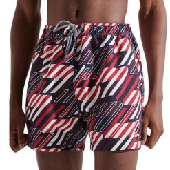 Spodenki kąpielowe męskie Superdry TRI SERIES SWIM. Niebieskie kąpielówki męskie Superdry, bez wzorów, z poliesteru, sportowe. Za 123.00 zł.