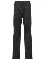 Guess Spodnie dresowe Z5BB07 K2042 Czarny Regular Fit. Czarne spodnie sportowe męskie Guess, m, z aplikacjami, z dresówki. Za 524.99 zł.