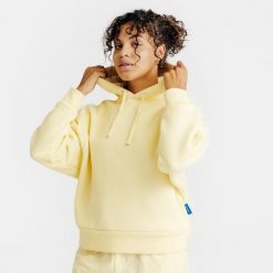 Bluza z kapturem damska Elementals. Żółte bluzy damskie Decathlon, s, bez wzorów, z bawełny, bez ramiączek, z kapturem. Za 179.99 zł.