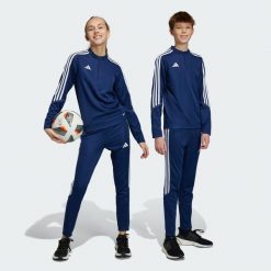 Tiro 23 Club Training Pants. Białe spodnie dresowe damskie Adidas, bez wzorów, z dresówki, sportowe, na fitness i siłownię. Za 110.99 zł.