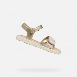 Sandały GEOX J SANDAL HAITI Złoty. Żółte sandały damskie Geox, bez wzorów, z syntetyku, bez obcasa, bez zapięcia. Za 224.99 zł.