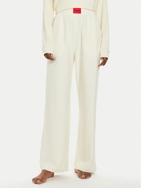 Hugo Spodnie piżamowe Snoozie 50523406 Écru Regular Fit. Piżamy damskie Hugo, bez wzorów, z syntetyku, bez ramiączek. Za 299.99 zł.
