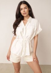 Beżowa Letnia Koszula z Krótkim Rękawem i Troczkiem w Talii Barbialla. Brązowe koszule damskie Born2be, m, bez wzorów, z jeansu, casualowe, bez kołnierzyka, bez ramiączek. Za 89.99 zł.