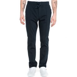 Tommy Hilfiger Spodnie dresowe Niebieski. Niebieskie spodnie sportowe męskie Tommy Hilfiger, l, bez wzorów, z bawełny. Za 602.95 zł.