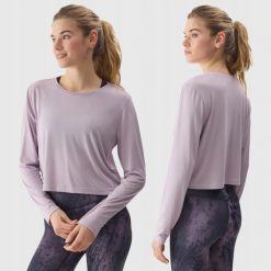 LONGSLEEVE DAMSKI 4F CROP-TOP DO JOG BLUZA Z DODATKIEM MODALU KOLOR FIOLETOWY. Fioletowe bluzy damskie 4F, l, bez wzorów, z materiału, sportowe, bez ramiączek, bez kaptura. Za 79.99 zł.
