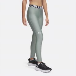 Legginsy treningowe damskie Under Armour HeatGear. Zielone legginsy damskie Under Armour, bez wzorów. Za 109.99 zł.