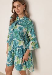 Niebieska Koszulowa Sukienka z Bawełny w Kwiatowy Wzór Ozdobiona Koralikami Astotea. Niebieskie sukienki damskie Born2be, do pracy, m, bez wzorów, z bawełny, biznesowe, bez kołnierzyka, bez ramiączek, mini, koszulowe. Za 109.99 zł.