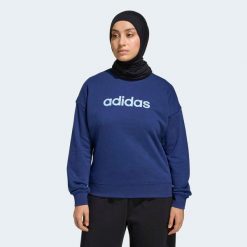 Bluza fitness damska ADIDAS. Niebieskie bluzy damskie Adidas, m, bez wzorów, z materiału, eleganckie, bez ramiączek, bez kaptura. Za 179.99 zł.