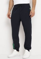 Granatowe Spodnie Dresowe z Zasuwanymi Kieszeniami i Nadrukiem Alarnori. Niebieskie spodnie sportowe męskie Born2be, m, bez wzorów, z dresówki. Za 54.99 zł.