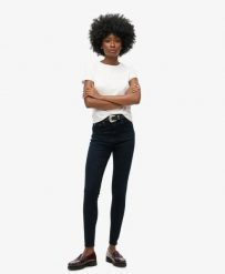 Superdry Wysokie damskie jeansy skinny z bawełny organicznej — Viper Blue Black. Niebieskie jeansy damskie Superdry, z aplikacjami, z bawełny, klasyczne, z podwyższonym stanem. Za 284.90 zł.