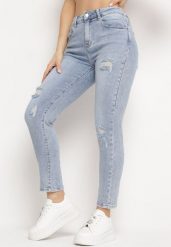 Jasnoniebieskie Jeansy o Fasonie Regular Ozdobione Przetarciami Ivispia. Niebieskie jeansy damskie Born2be, bez wzorów, z jeansu. Za 99.99 zł.