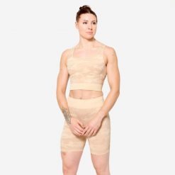 Koszulka fitness damska Domyos crop top. Brązowe topy damskie DOMYOS, xs, bez wzorów, z elastanu, sportowe, bez kołnierzyka, bez ramiączek. W wyprzedaży za 69.99 zł.