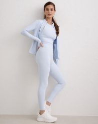 Damskie legginsy z wysokim stanem, squat proof, dla niskich Sense niebieskie. Niebieskie legginsy damskie Aim'n, bez wzorów, z elastanu. Za 297.00 zł.